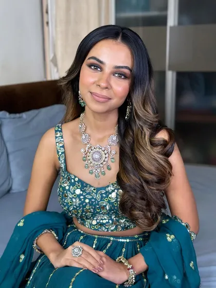 This look proves that glam can still feel light and effortless. The skin is kept fresh and dewy to balance the smokey eye.
