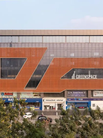 Our commercial work aims to create landmarks. The facade for 'Greenspace' uses a dynamic arrangement of materials and voids to stand out in the cityscape, reflecting a contemporary and forward-thinking identity for the businesses within.