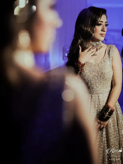 A portrait of a bride looking over her shoulder, with soft, diffused lighting creating a dreamy and ethereal effect.