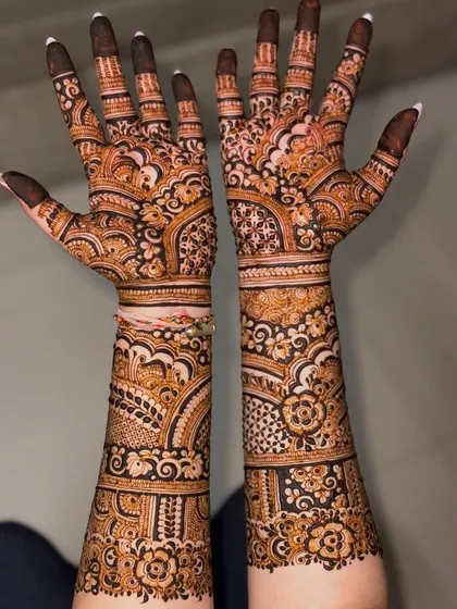 A unique pose showing the full length of this beautiful engagement mehendi.