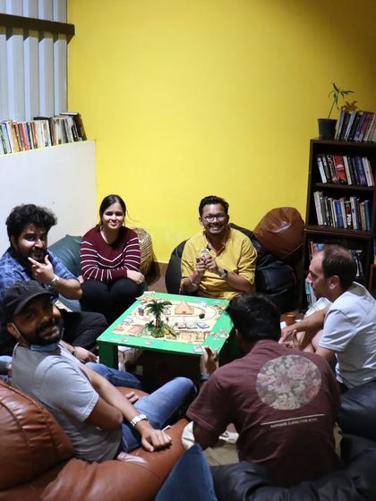 A lively discussion during a game in our bean bag lounge. This is where strategies are debated and alliances are formed.