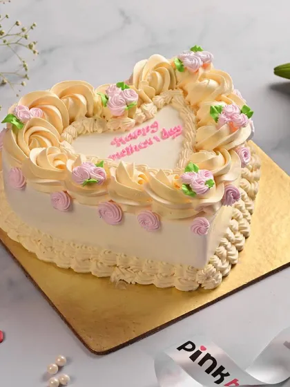 We create cakes for all your special moments. This heart-shaped cake was designed for Mother's Day, featuring delicate buttercream roses to show your appreciation for mom.