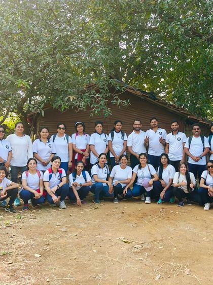 Our trekking group posing in front of a rustic hut. Combining hiking with yoga is a perfect way to rejuvenate the body and soul.