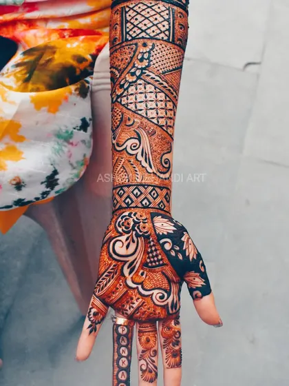 For those who want a heavier look, I extend the intricate patterns up the arm. This design features a mix of paisleys, florals, and geometric fills for a stunning full-arm piece.