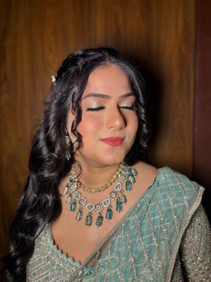 A close-up of the makeup, with a focus on the soft, shimmery eyeshadow.