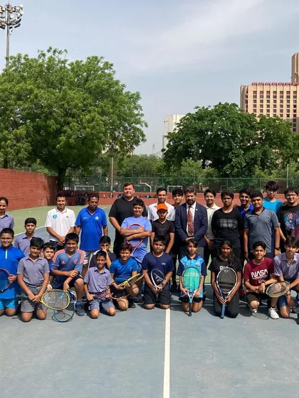 A group photo of our junior players with our coaching team, including Director Todd Clark, at the re-launch of our program. This image represents the strong community and supportive team environment we foster, where players of all ages come together to pursue their passion for tennis.