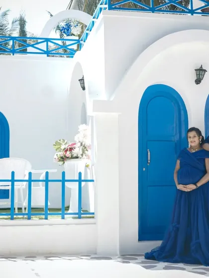 A wide shot of the Santorini-themed set, showing the beautiful architecture. This location offers multiple angles and spots for a diverse and stylish photoshoot.