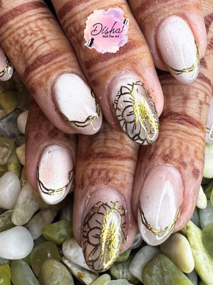 A closer look at the beautiful results of nail stamping. The fine lines of the floral pattern and the metallic gold details create a truly elegant and sophisticated design.