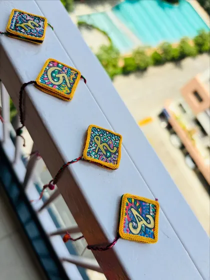 My AksharBandhan Rakhis make the festival of Raksha Bandhan extra personal. Each one is hand-painted on a wooden base with your brother's initial, surrounded by my signature colorful patterns.