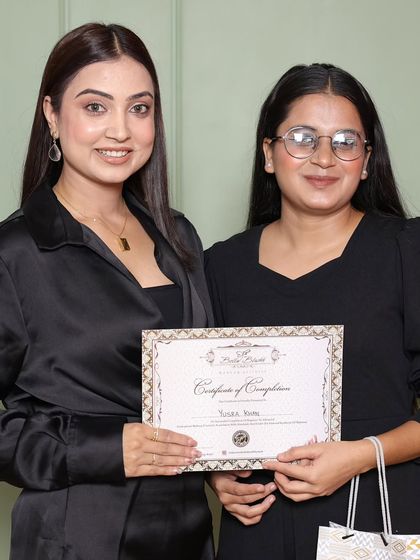 Another proud graduate receiving her certificate. I make sure every student leaves with the skills and confidence to start their own business.