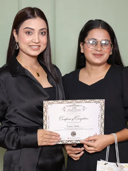 Another proud graduate receiving her certificate. I make sure every student leaves with the skills and confidence to start their own business.