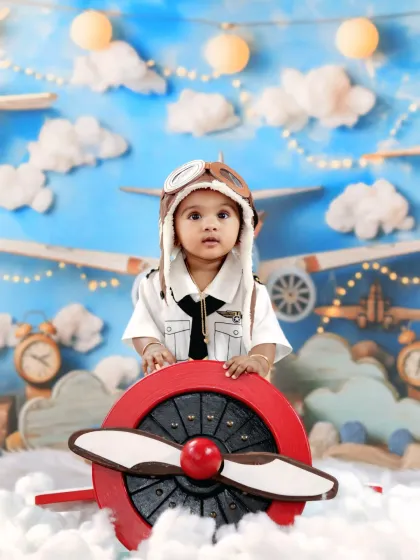 Let your child's dreams take flight with our adorable pilot-themed photoshoot. This setup includes a custom-built propeller plane, fluffy clouds, and a vintage aviator hat for a picture-perfect adventure in the skies.