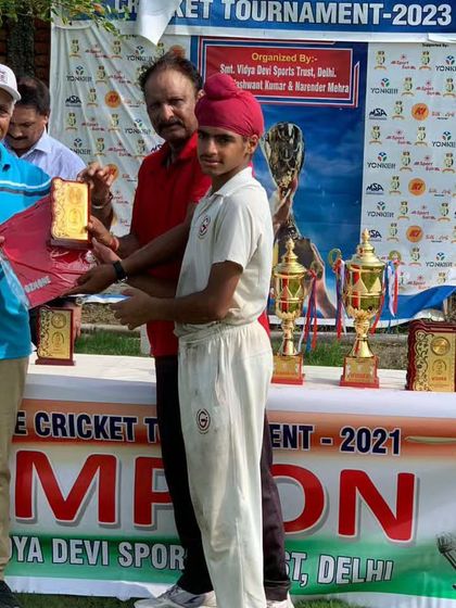 Samraj Singh, another of my talented players, receiving his award at a cricket tournament.