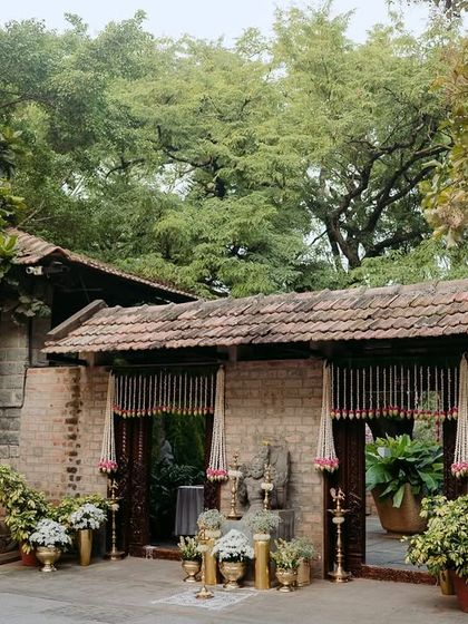 The entrance decorated with flowers and traditional elements, showcasing a beautiful setup by a decor partner.