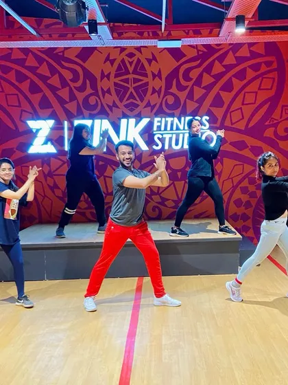 Posing on the stage after a great class. This space is for everyone to feel like a performer and have their moment to shine.