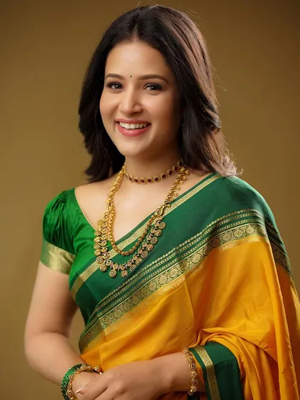I believe traditional wear has its own modern attitude. Here, I focused on capturing a genuine, radiant smile, letting the vibrant colors of the silk saree and the classic gold jewelry shine in a clean, elegant portrait.