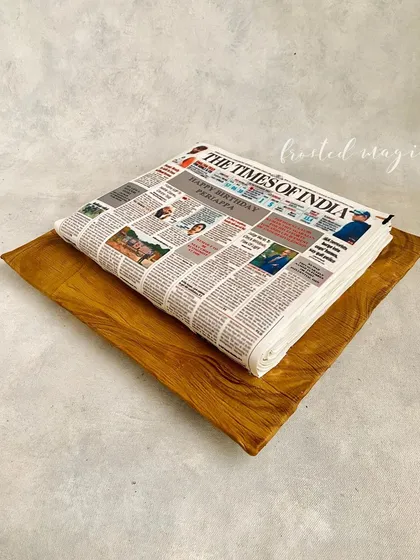 Is it a newspaper or is it a cake? I had so much fun creating this hyper-realistic Times of India newspaper cake. Every detail is printed on edible paper to look just like the real thing, making for a truly surprising and memorable celebration cake.