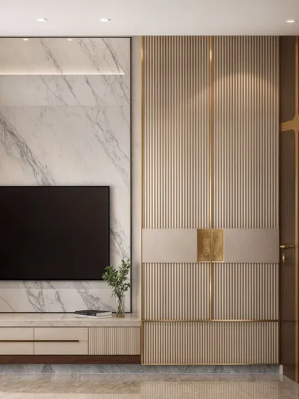 A master bedroom featuring a sophisticated combination of marble, fluted panels, and gold accents on the TV and wardrobe wall.