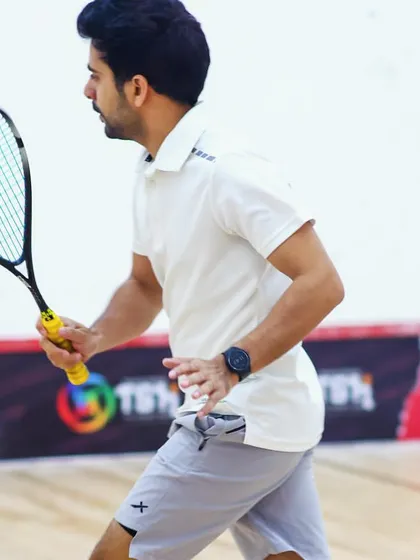 In my element on the court during the TSH Squash Open. I still compete at a high level to stay sharp for my students.