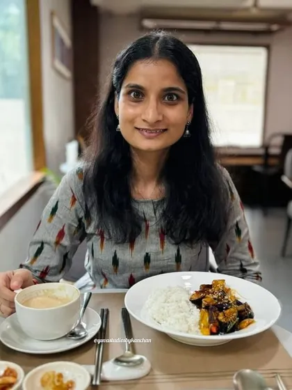 A happy client enjoying her meal in my best-selling grey Ikat kurta pant set. Seeing my designs become a part of your special moments is truly rewarding.