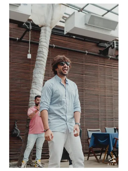 The groom's priceless reaction of shock and happiness as the surprise proposal unfolds. Capturing these genuine, unscripted reactions is what makes a moment unforgettable.