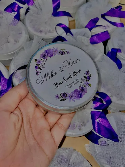 A custom-labeled tin jar candle for Neha and Varun's housewarming, but this style is also very popular for wedding and engagement favors. The purple floral design is so elegant.