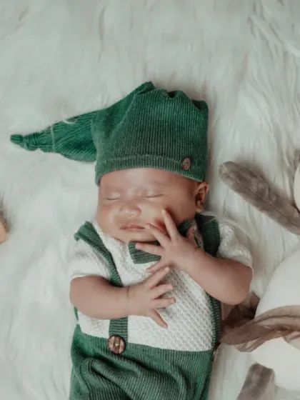 One month of sleepy smiles. I love capturing these milestone moments with cute outfits and props that tell the story of your baby's first weeks.