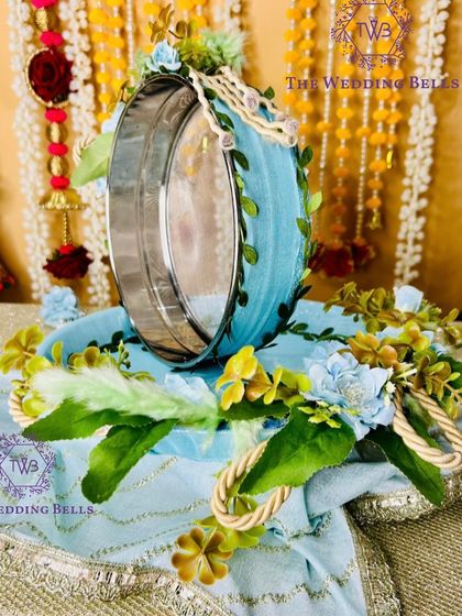 A close-up of the sieve from our ice blue floral thali set. The leaf and vine details add a touch of nature-inspired elegance.