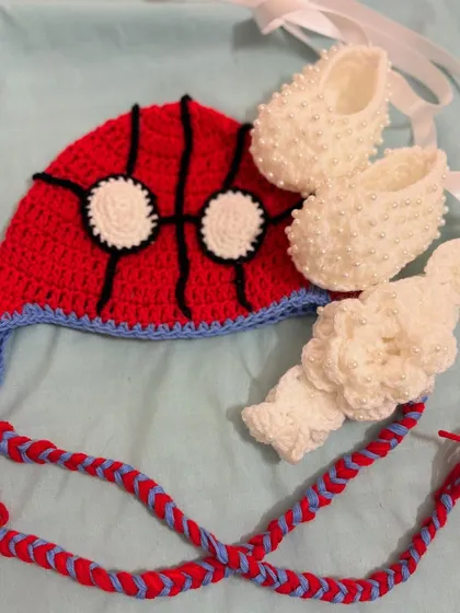 Your little superhero will look adorable in this Spider-Man inspired baby set. I used soft cotton yarn to create the beanie, booties, and a matching headband, ensuring it's comfortable and breathable for delicate skin.