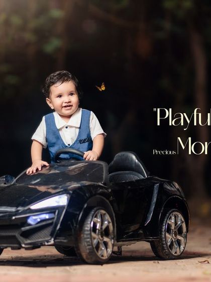 Playful portraits presenting precious moments. A happy little boy enjoys a ride in his toy car, with a butterfly fluttering by.