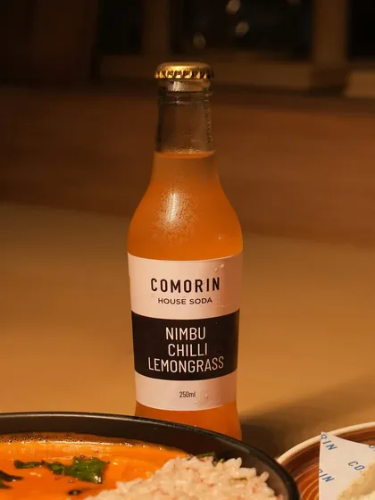 Our house-made Nimbu Chilli Lemongrass soda is the perfect drink to cut through the heat of a spicy curry. Its bright, citrusy flavor with a hint of chili keeps you going for one more bite.