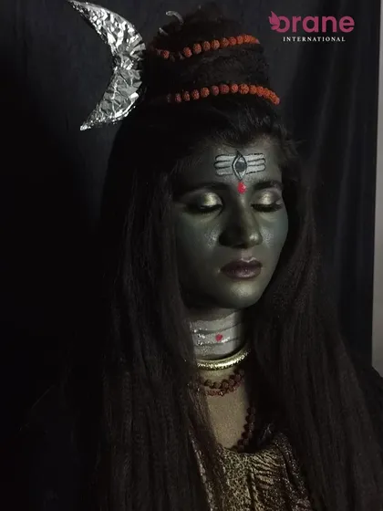 A dramatic, low-key lighting shot that adds to the powerful aura of the Mahashivratri look.