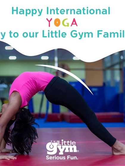 A young gymnast demonstrates a perfect back bridge, showcasing incredible flexibility. This pose, similar to yoga's wheel pose, is a cornerstone of gymnastics training.