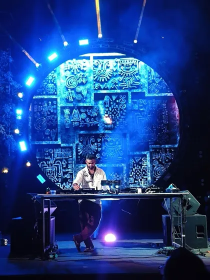 Performing on a stage with intricate, custom-designed visuals. I work to ensure my music is complemented by a stunning visual production, creating a fully immersive experience.