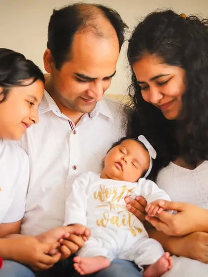 Welcoming a new baby is a moment for the whole family. We love capturing the gentle curiosity of a new big sister and the overwhelming love of the parents during our at-home newborn sessions.
