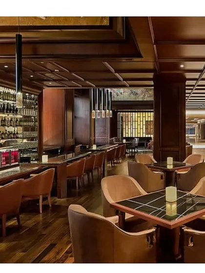 The ambiance of the bar and lounge at the Sheraton Bangalore. We used rich wood paneling, coffered ceilings, and focused pendant lighting to create an intimate, sophisticated atmosphere for guests.