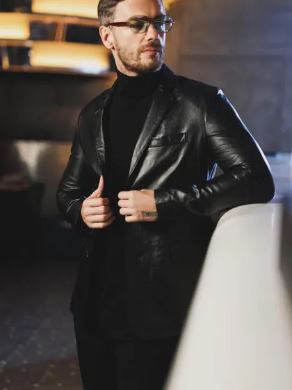 For this autumn winter campaign, I styled a classic black leather blazer over a turtleneck. It's a timeless combination that exudes confidence and is perfect for an evening of sophisticated style.