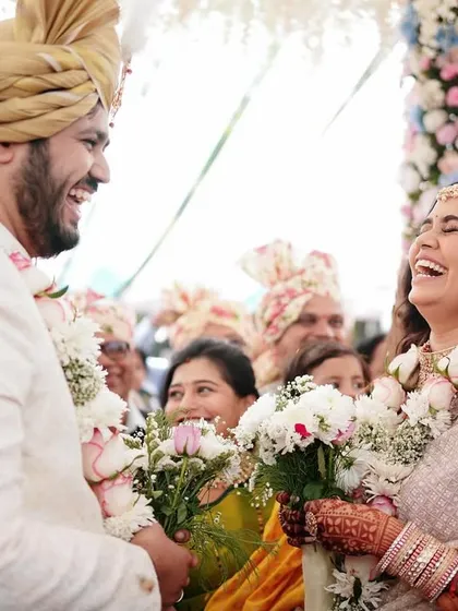 A beautiful moment of laughter and connection between the bride and groom during their ceremony. These candid interactions make the best memories.