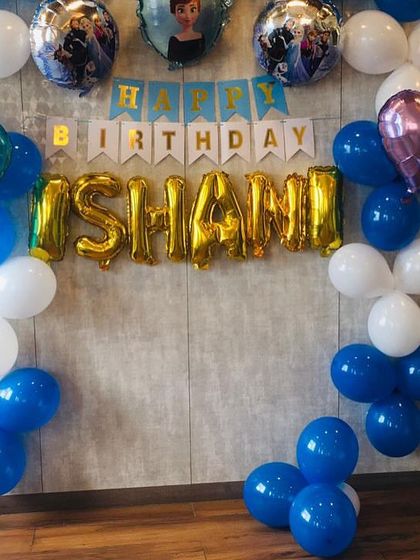 Let it go and celebrate. This Frozen-themed birthday party for Ishani was a winter wonderland, with blue and white balloons, character foil balloons of Elsa and Anna, and a festive "Happy Birthday" banner.