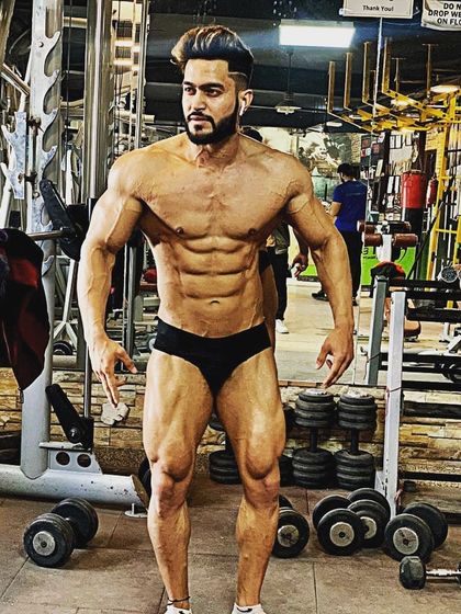 A full-body shot in contest condition. This demonstrates the balance, symmetry, and definition from head to toe that I strive for and teach my clients to achieve.