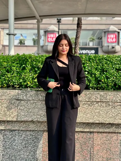 Adjusting my professional attire. Every detail is a part of being prepared to represent someone in a court of law.
