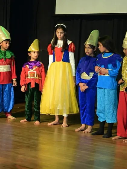 Teamwork is at the heart of every production. Here, Snow White and the Seven Dwarfs stand together, a perfect example of how our students learn to collaborate, support each other's roles, and create a cohesive story as an ensemble.