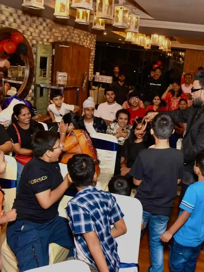 A candid shot of me interacting with the audience. I make sure to move around and engage with everyone, not just those on stage.