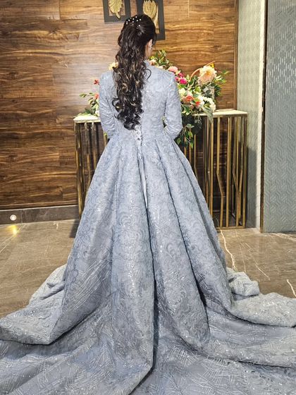 The full trail of the magnificent gown. This is how you make a grand entrance.