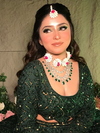 A close-up of my 'Mehendi Vibes' look. The makeup features a beautiful green smokey eye, flawless skin, and is paired with custom floral and diamond jewelry.