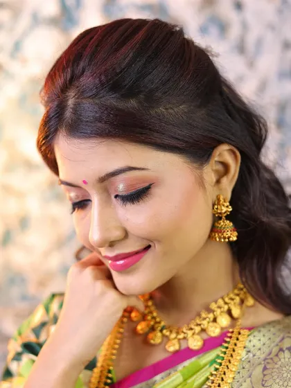 A close-up of the soft eye makeup, with a touch of shimmer and a glossy pink lip.