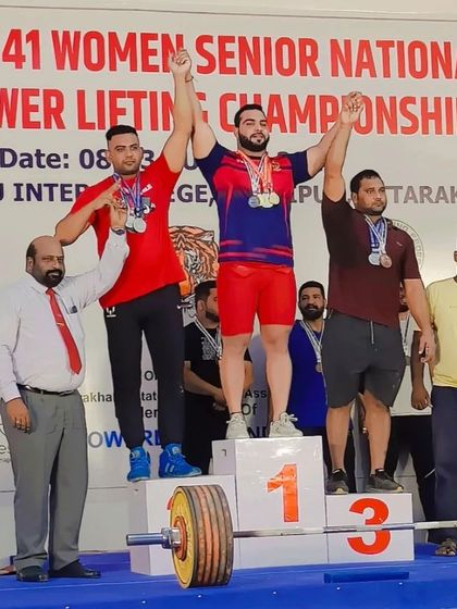 My student on the podium after winning the Senior National Powerlifting Championship in 2023. He took home gold medals in all three lifts and the overall category.