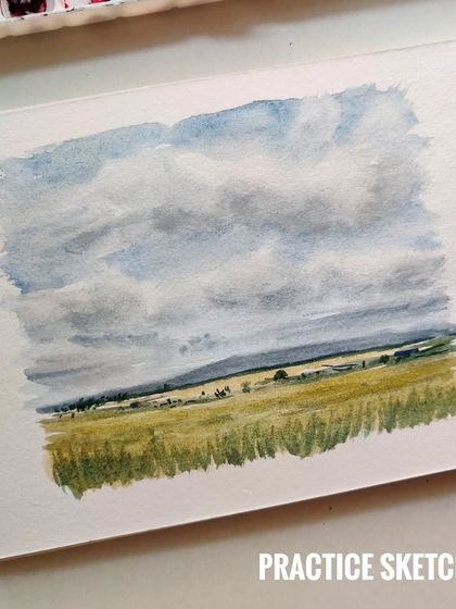 This was the final attempt at a watercolor landscape after a few practice sketches. Painting clouds and fields in watercolor can be tricky, but I was happy with the freshness of the sky in this version.