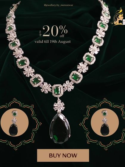 A full view of the exquisite emerald green bridal necklace set. This piece features a large teardrop pendant and is designed for the bride who wants to look nothing less than royal.