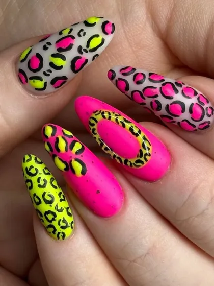 For those who love to make a statement. This bold nail art features a vibrant mix of neon pink and yellow with a hand-painted leopard print design, showing our passion for creative and eye-catching looks.